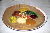 Injera - traditional ethiopian food. It is sour cake with meat or vegetable sauces. North,  Ethiopia.