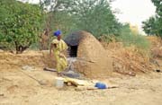 Bread baking. Niafunk village. Mali.