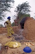 Bread baking. Niafunk village. Mali.