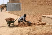 Making of traditional muddy bricks. They are used for building of majority houses. Agadez town. Niger.