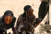 Men from nomadic Wodaab tribe (also called Bororo) prepare themselves for Yaake dance. Cure Sale (Salt cure) festival at In-Gall town. Niger.