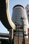 Osaka city. Subway is going through skyscraper. Japan.