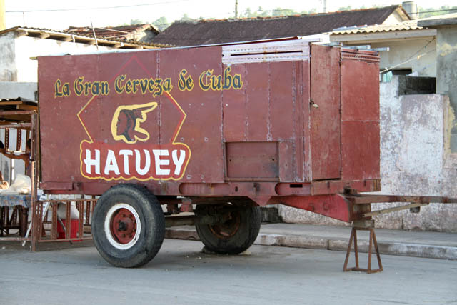 Nice beer advertising at cart - use of the cart is unknown. Baracoa town. Cuba.