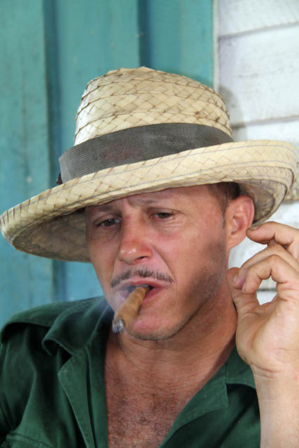Enjoying self made cigar, tobacco farm, Vinales valley (Valle de Vinales). Cuba.